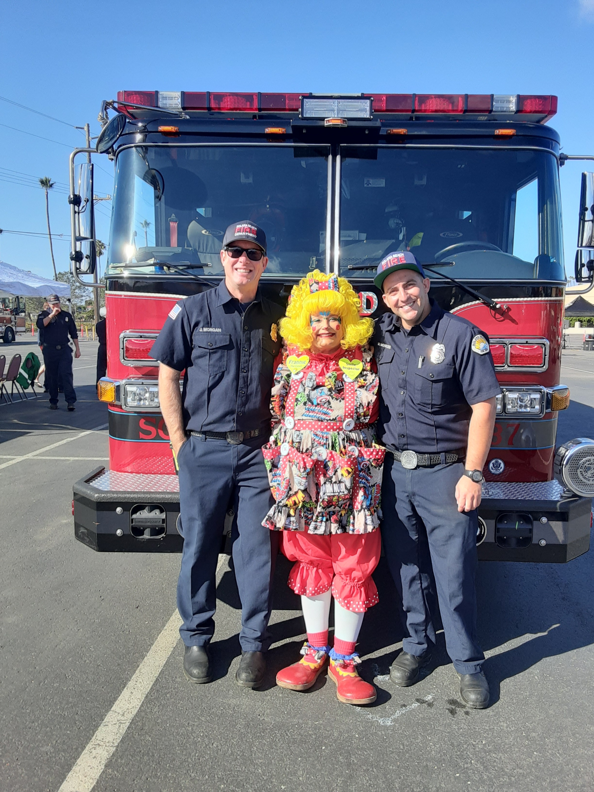 Frannie the Clown with firefighters